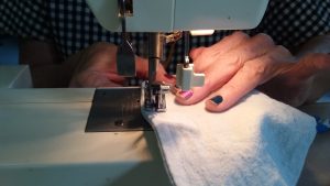 sewing machine close hands